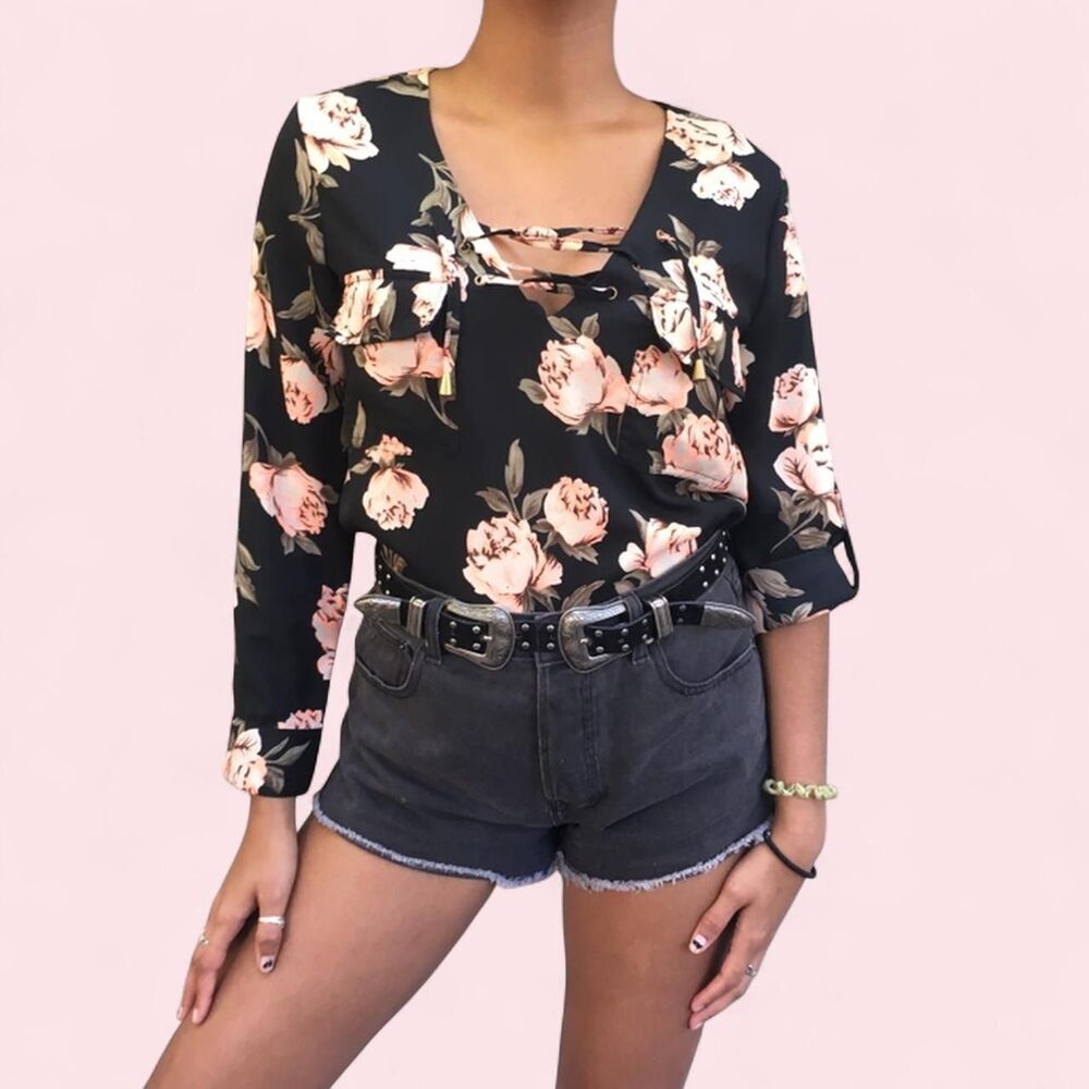 Floral blouse with pink roses on it